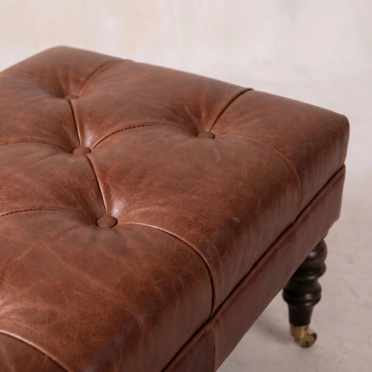 Buffalo Brown Leather Ottoman with Castor Legs